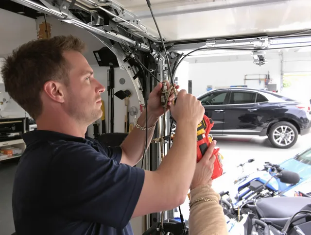 Middleburg Heights Garage Door Repair safety certified technician performing cable replacement in Middleburg Heights