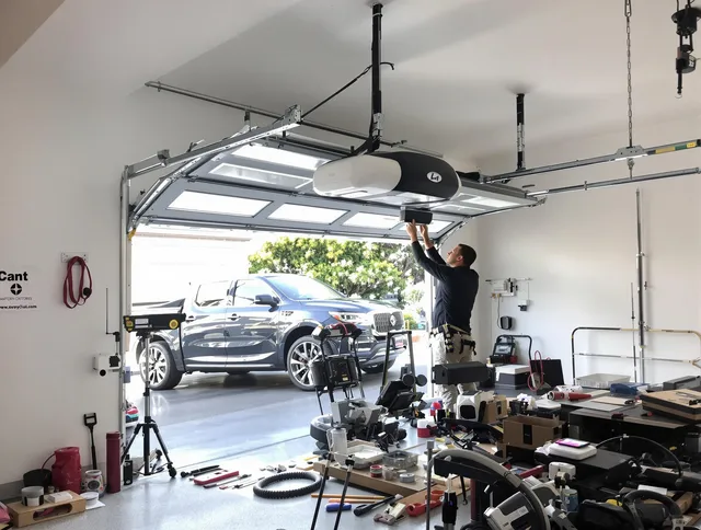 Middleburg Heights Garage Door Repair specialist installing smart garage door opener system in Middleburg Heights home